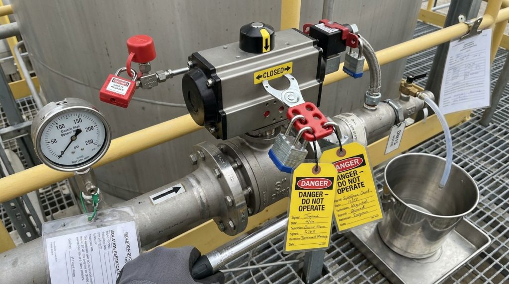 Lockout tagout setup with pressure gauge and drain point before valve maintenance