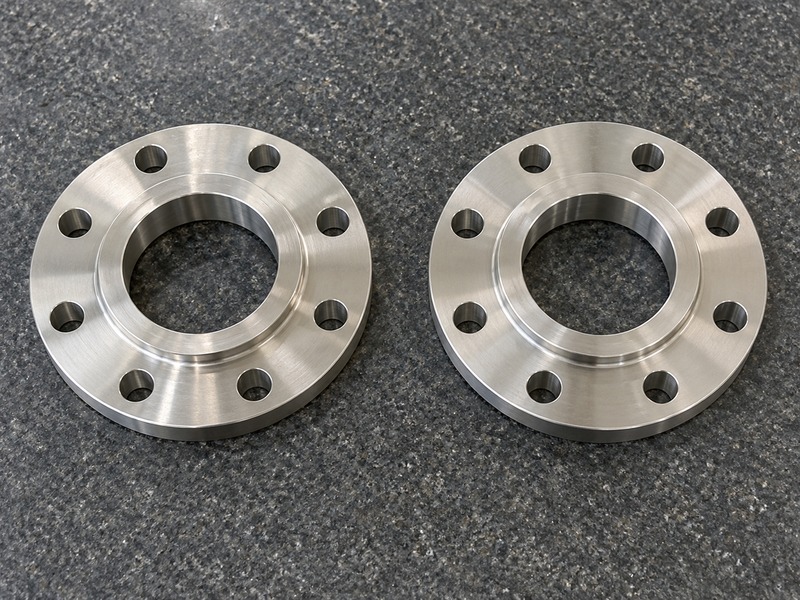 keystone dn80 butterfly valve — Two separate unmarked eight-hole pipe flanges for interface review